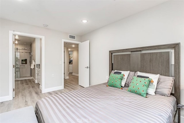 4014 Calle Sonora Oeste Unit 2B, Laguna Woods, CA 92637 - bedroom with light wood-style flooring, recessed lighting, and ensuite bathroom