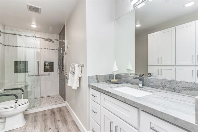 4014 Calle Sonora Oeste Unit 2B, Laguna Woods, CA 92637 - full bathroom with vanity, a stall shower, recessed lighting, and wood finished floors