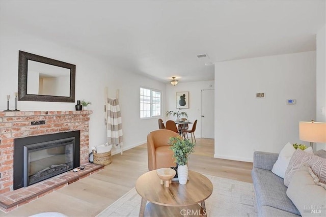 367 E Pacific Ave, Fairfield, CA 94533 - living area with light wood-style floors and a fireplace