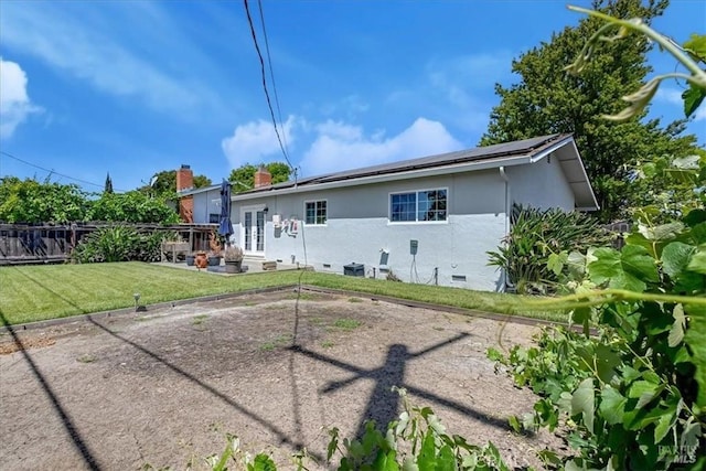 367 E Pacific Ave, Fairfield, CA 94533 - rear view of property featuring stucco siding, a patio, crawl space, and roof mounted solar panels
