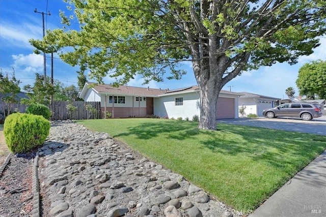 367 E Pacific Ave, Fairfield, CA 94533 - ranch-style house featuring roof mounted solar panels, driveway, a garage, and stucco siding