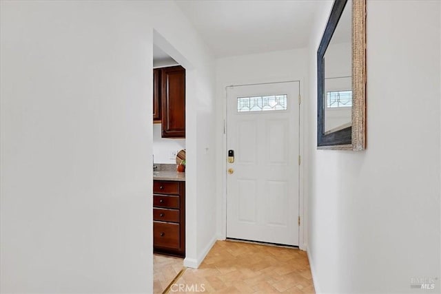 367 E Pacific Ave, Fairfield, CA 94533 - doorway to outside featuring baseboards