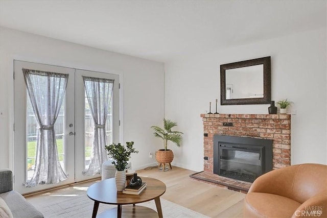 367 E Pacific Ave, Fairfield, CA 94533 - living room featuring french doors, wood finished floors, and a fireplace