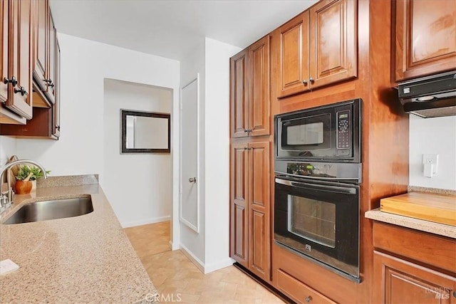 367 E Pacific Ave, Fairfield, CA 94533 - kitchen with black appliances, brown cabinets, and range hood