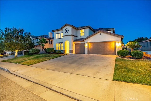 40028 Bluff Ct, Palmdale, CA 93551 - mediterranean / spanish-style house with an attached garage, a front yard, stucco siding, and concrete driveway
