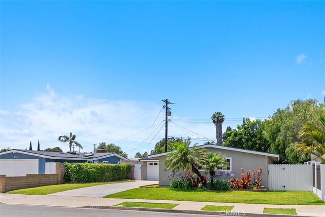 2323 Colgate Dr, Costa Mesa, CA 92626 - view of front of house with driveway, a garage, stucco siding, and a gate