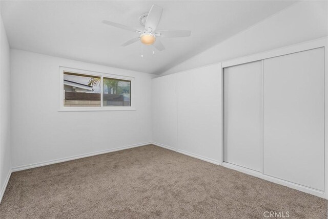 2323 Colgate Dr, Costa Mesa, CA 92626 - unfurnished bedroom featuring carpet, lofted ceiling, a closet, and a ceiling fan