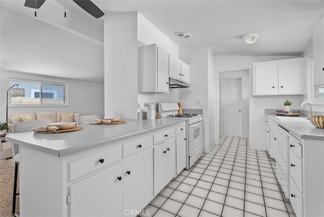 2323 Colgate Dr, Costa Mesa, CA 92626 - kitchen featuring white gas stove, a peninsula, light countertops, under cabinet range hood, and a ceiling fan