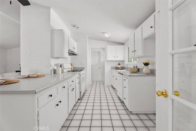 2323 Colgate Dr, Costa Mesa, CA 92626 - kitchen with white appliances, vaulted ceiling, light countertops, under cabinet range hood, and white cabinets