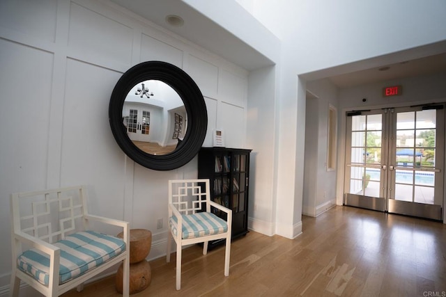 4336 Harbor Way Unit 1, Oceanside, CA 92056 - sitting room with wood finished floors and french doors
