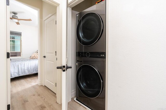 4336 Harbor Way Unit 1, Oceanside, CA 92056 - laundry area featuring estacked washer and dryer, light wood-style floors, and a ceiling fan