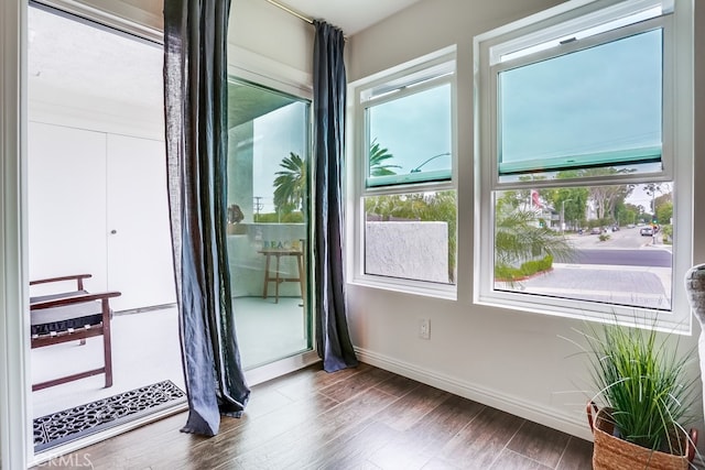 240 Nice Ln Unit 114, Newport Beach, CA 92663 - spare room with baseboards and wood finished floors