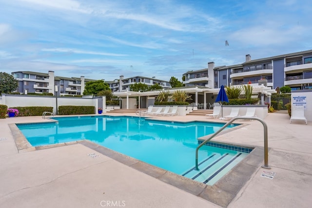 240 Nice Ln Unit 114, Newport Beach, CA 92663 - community pool featuring a patio