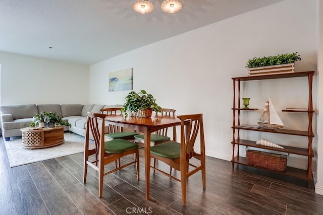 240 Nice Ln Unit 114, Newport Beach, CA 92663 - dining room with dark wood-type flooring and baseboards