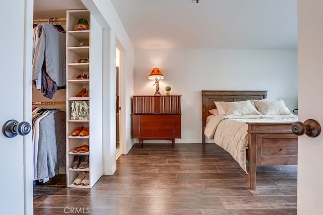 240 Nice Ln Unit 114, Newport Beach, CA 92663 - bedroom with dark wood-style floors and baseboards