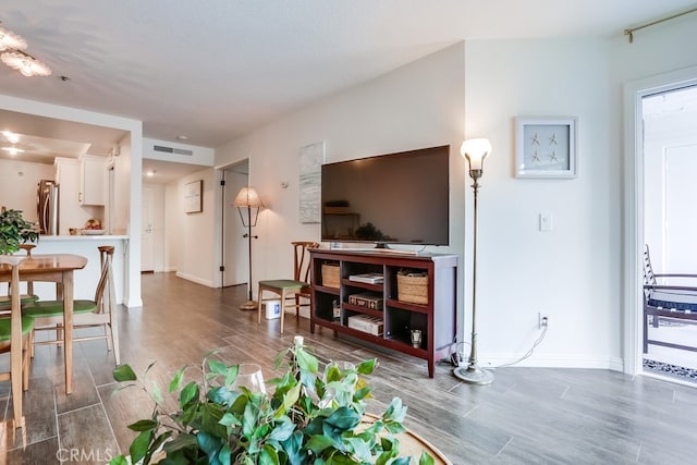 240 Nice Ln Unit 114, Newport Beach, CA 92663 - living room featuring wood finished floors and baseboards