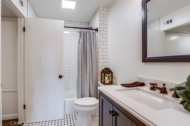 240 Nice Ln Unit 114, Newport Beach, CA 92663 - bathroom with vanity and shower / tub combo with curtain