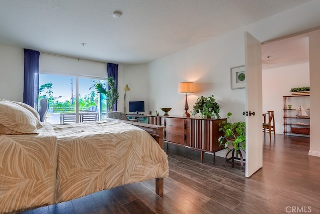 240 Nice Ln Unit 114, Newport Beach, CA 92663 - bedroom featuring wood finished floors and access to exterior
