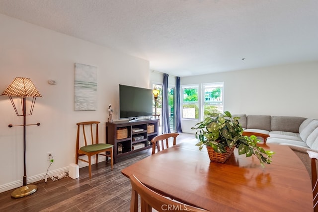 240 Nice Ln Unit 114, Newport Beach, CA 92663 - living room with dark wood-style floors and baseboards