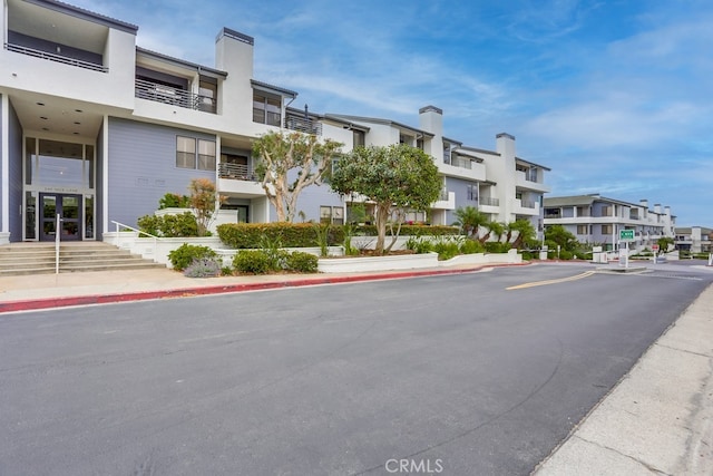 240 Nice Ln Unit 114, Newport Beach, CA 92663 - view of building exterior with a residential view