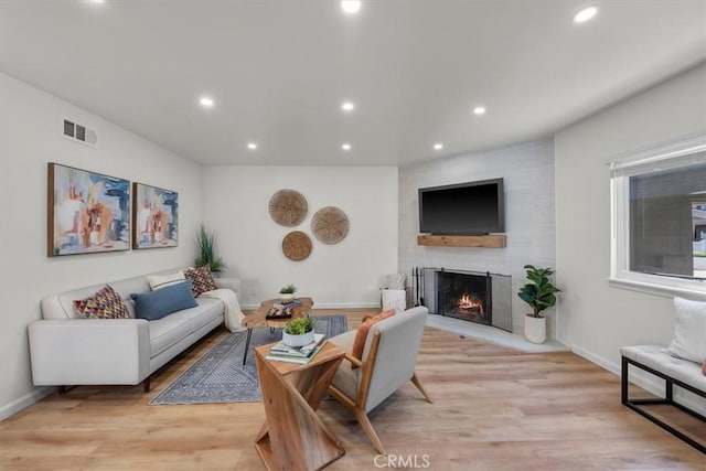 14508 Burin Ave, Lawndale, CA 90260 - living room featuring recessed lighting, a large fireplace, and light wood finished floors