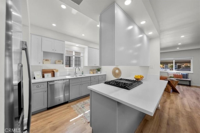 14508 Burin Ave, Lawndale, CA 90260 - kitchen featuring stainless steel appliances, gray cabinets, light wood-type flooring, light countertops, and recessed lighting