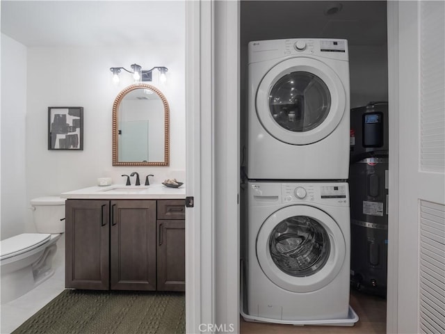 402 W Grand Ave Unit 101, Grover Beach, CA 93433 - laundry area with stacked washer / drying machine