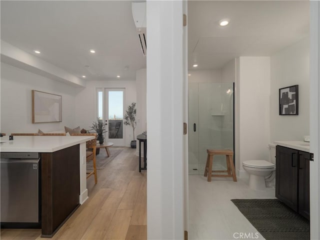 402 W Grand Ave Unit 101, Grover Beach, CA 93433 - full bath with a stall shower, vanity, recessed lighting, a freestanding tub, and wood finished floors