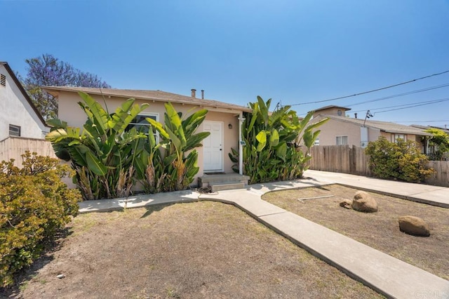1185 Elm Ave, Chula Vista, CA 91911 - view of property hidden behind natural elements featuring stucco siding