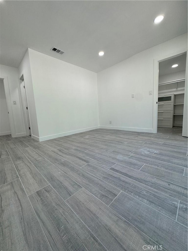 5230 Seville Ave, Encino, CA 91436 - empty room with wood finished floors and recessed lighting