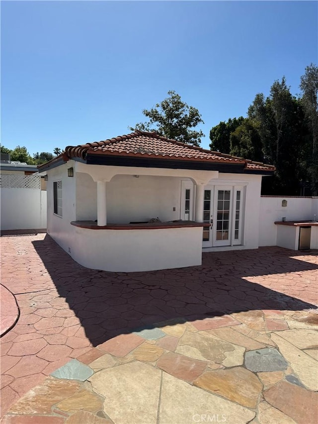 5230 Seville Ave, Encino, CA 91436 - back of house featuring a tile roof, french doors, a patio, and stucco siding