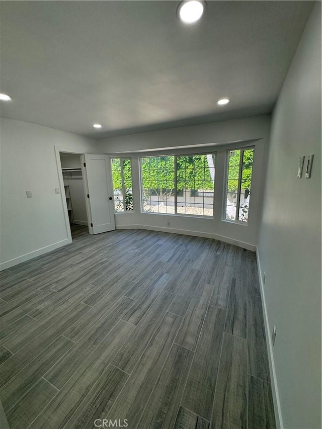 5230 Seville Ave, Encino, CA 91436 - unfurnished living room with plenty of natural light, dark wood-type flooring, and recessed lighting