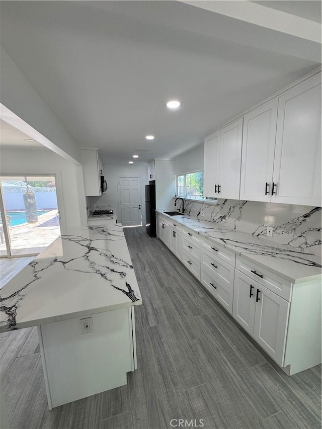 5230 Seville Ave, Encino, CA 91436 - kitchen with freestanding refrigerator, recessed lighting, white cabinetry, and dark wood-style floors