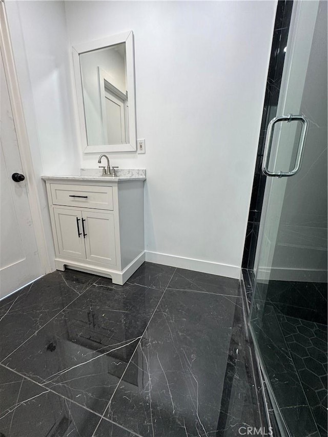 5230 Seville Ave, Encino, CA 91436 - bathroom with marble tiled flooring, vanity, and a stall shower