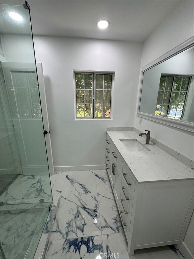 5230 Seville Ave, Encino, CA 91436 - bathroom with vanity, recessed lighting, marble look tiles, walk in shower, and healthy amount of natural light