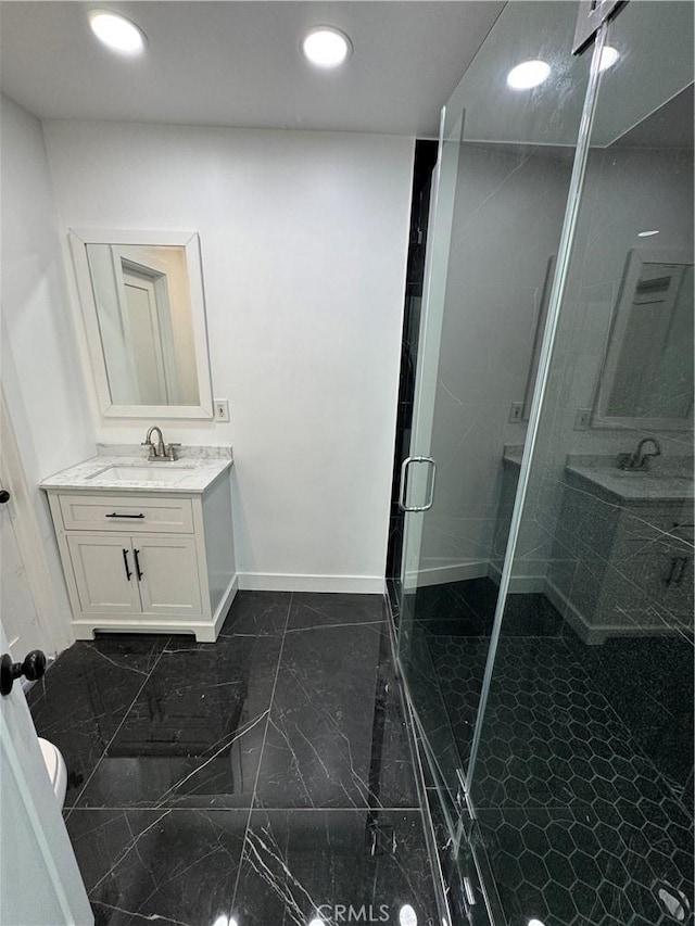 5230 Seville Ave, Encino, CA 91436 - full bathroom featuring vanity, a shower stall, marble finish flooring, and recessed lighting