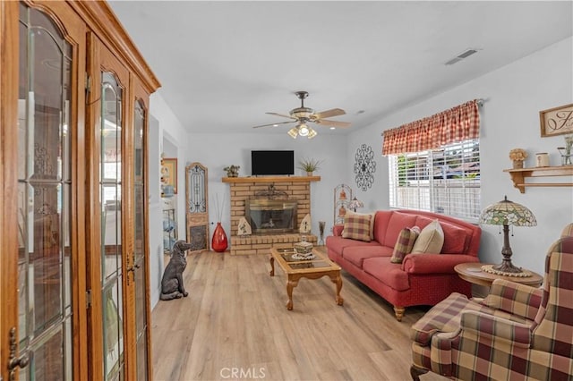 23609 Canyon Lake Dr N, Canyon Lake, CA 92587 - living area with light wood finished floors, ceiling fan, and a fireplace