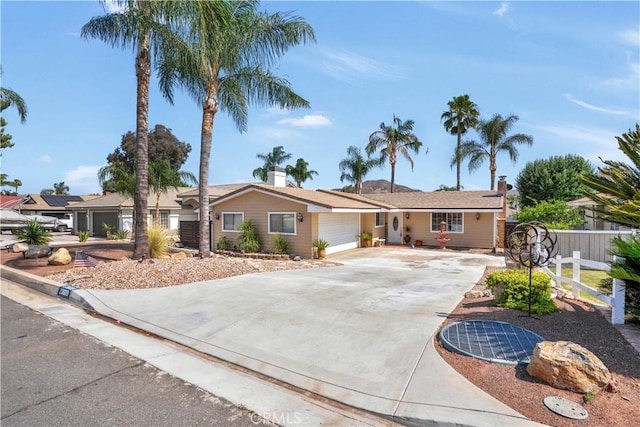 23609 Canyon Lake Dr N, Canyon Lake, CA 92587 - single story home with driveway, a garage, and a chimney