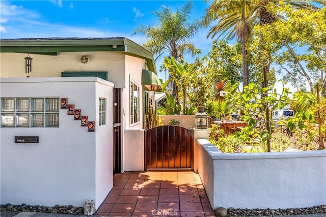24932 La Cresta Dr, Dana Point, CA 92629 - view of home's exterior with stucco siding and a gate