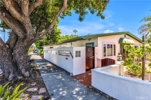 24932 La Cresta Dr, Dana Point, CA 92629 - view of front of home featuring stucco siding and a fenced front yard