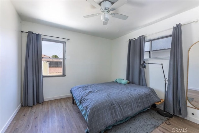 15508 Elmcroft Ave, Norwalk, CA 90650 - bedroom featuring multiple windows, wood finished floors, and ceiling fan