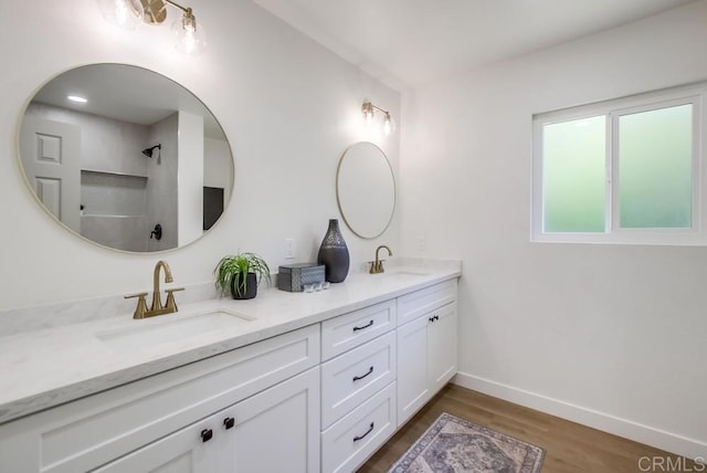 2451 Helix St, Spring Valley, CA 91977 - bathroom with double vanity and wood finished floors