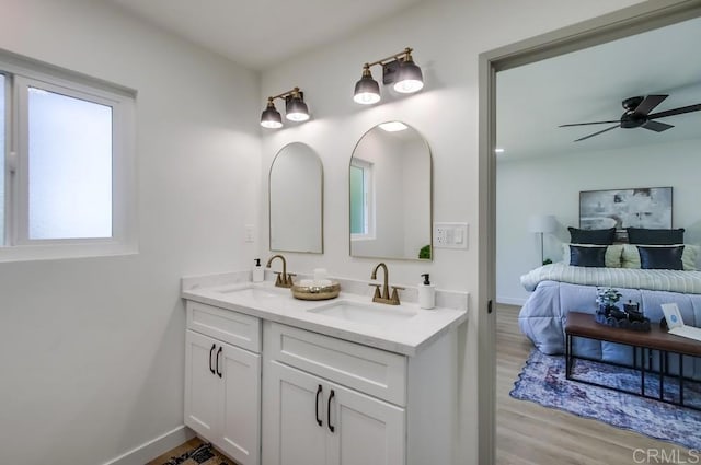 2451 Helix St, Spring Valley, CA 91977 - ensuite bathroom with double vanity, wood finished floors, and ceiling fan