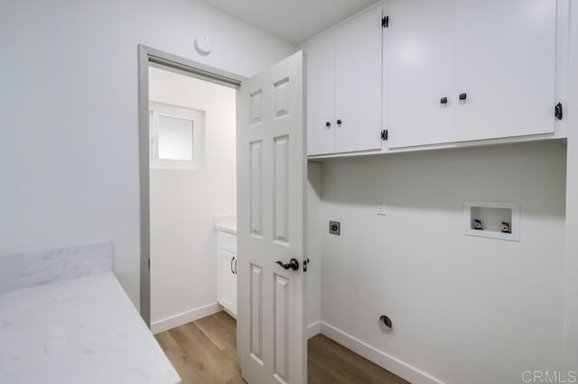 2451 Helix St, Spring Valley, CA 91977 - laundry room with light wood-style flooring, washer hookup, cabinet space, and hookup for an electric dryer