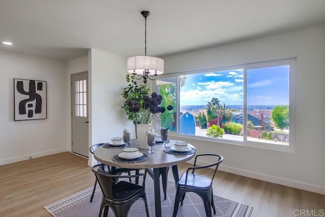 2451 Helix St, Spring Valley, CA 91977 - dining room with light wood-type flooring and a chandelier