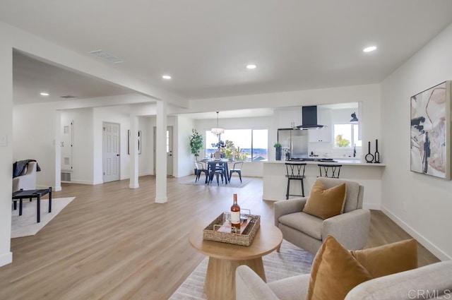 2451 Helix St, Spring Valley, CA 91977 - living area with light wood-type flooring and recessed lighting