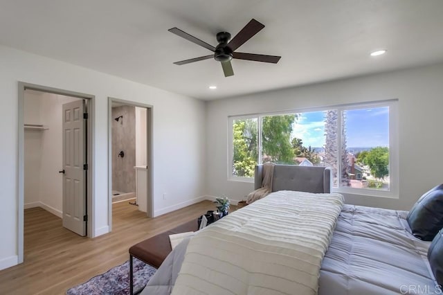 2451 Helix St, Spring Valley, CA 91977 - bedroom with a spacious closet, light wood-style floors, recessed lighting, connected bathroom, and a ceiling fan