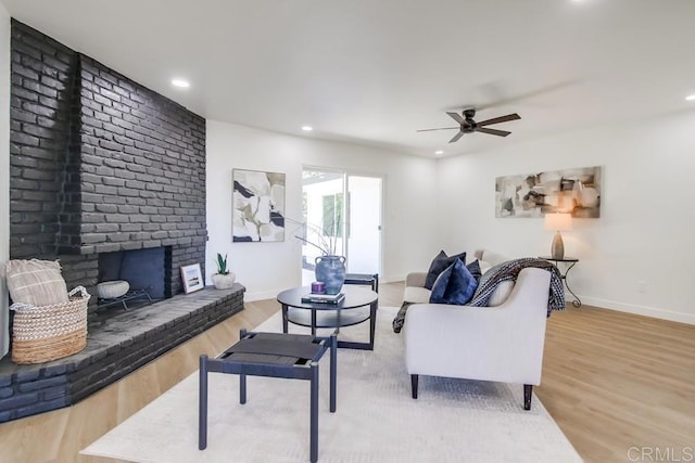 2451 Helix St, Spring Valley, CA 91977 - living area with ceiling fan, a fireplace, wood finished floors, and recessed lighting