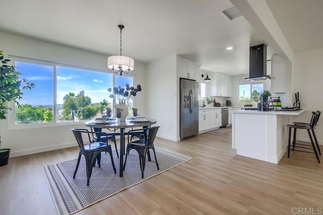 2451 Helix St, Spring Valley, CA 91977 - dining space featuring light wood-style flooring, a chandelier, and recessed lighting