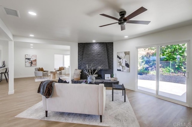 2451 Helix St, Spring Valley, CA 91977 - living room featuring wood finished floors, ceiling fan, recessed lighting, and a brick fireplace